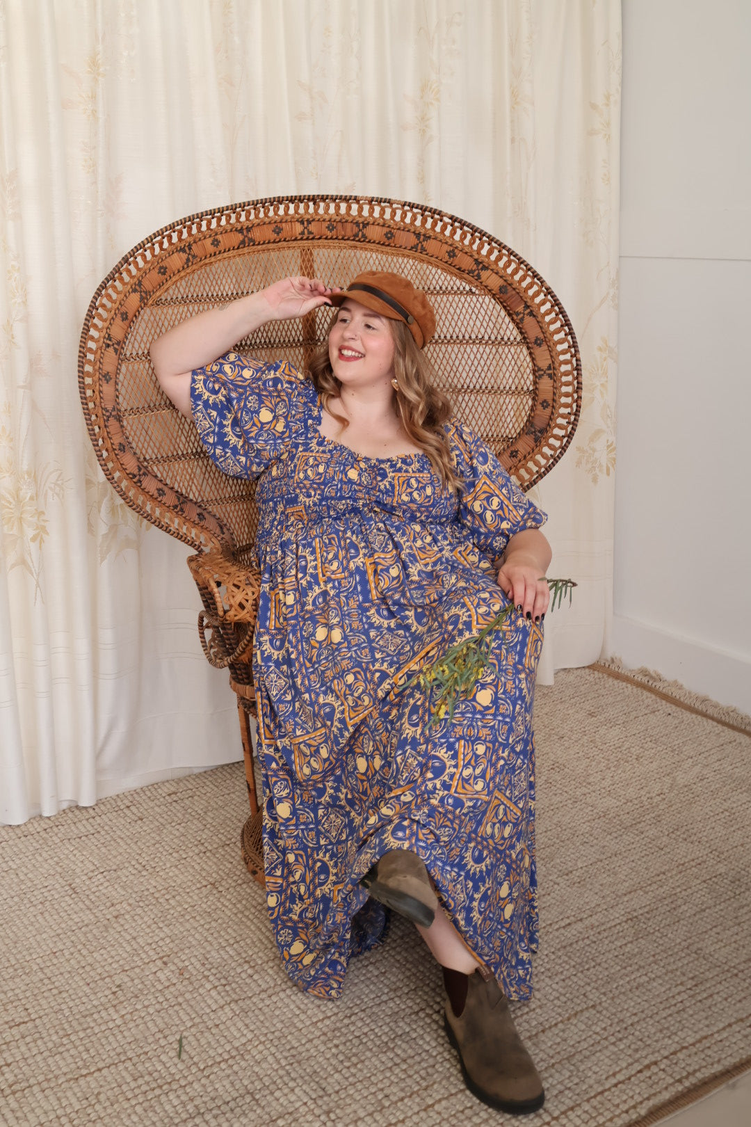 Curvy woman wearing a flowing Mama Mane dress, feeling confident in Australian curve and plus size boho fashion.